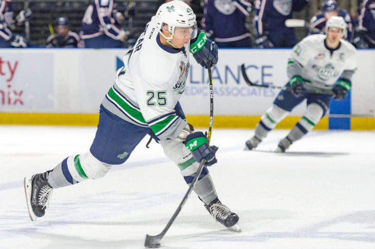 Ethan Bear taking a slapshot during the 2016-17 season at accesso ShoWare Center.
