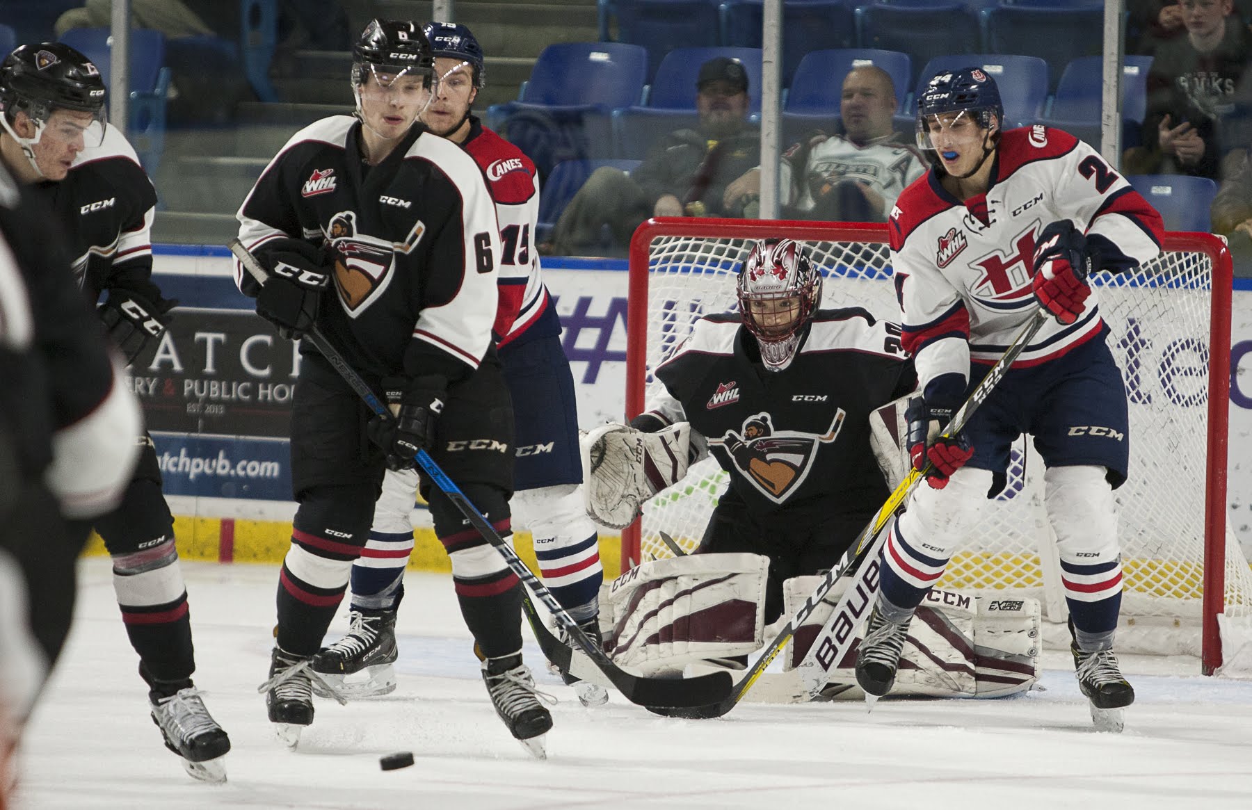 Vancouver Giants goaltender David Tendeck looks through a crowd against the Lethbridge Hurricanes.