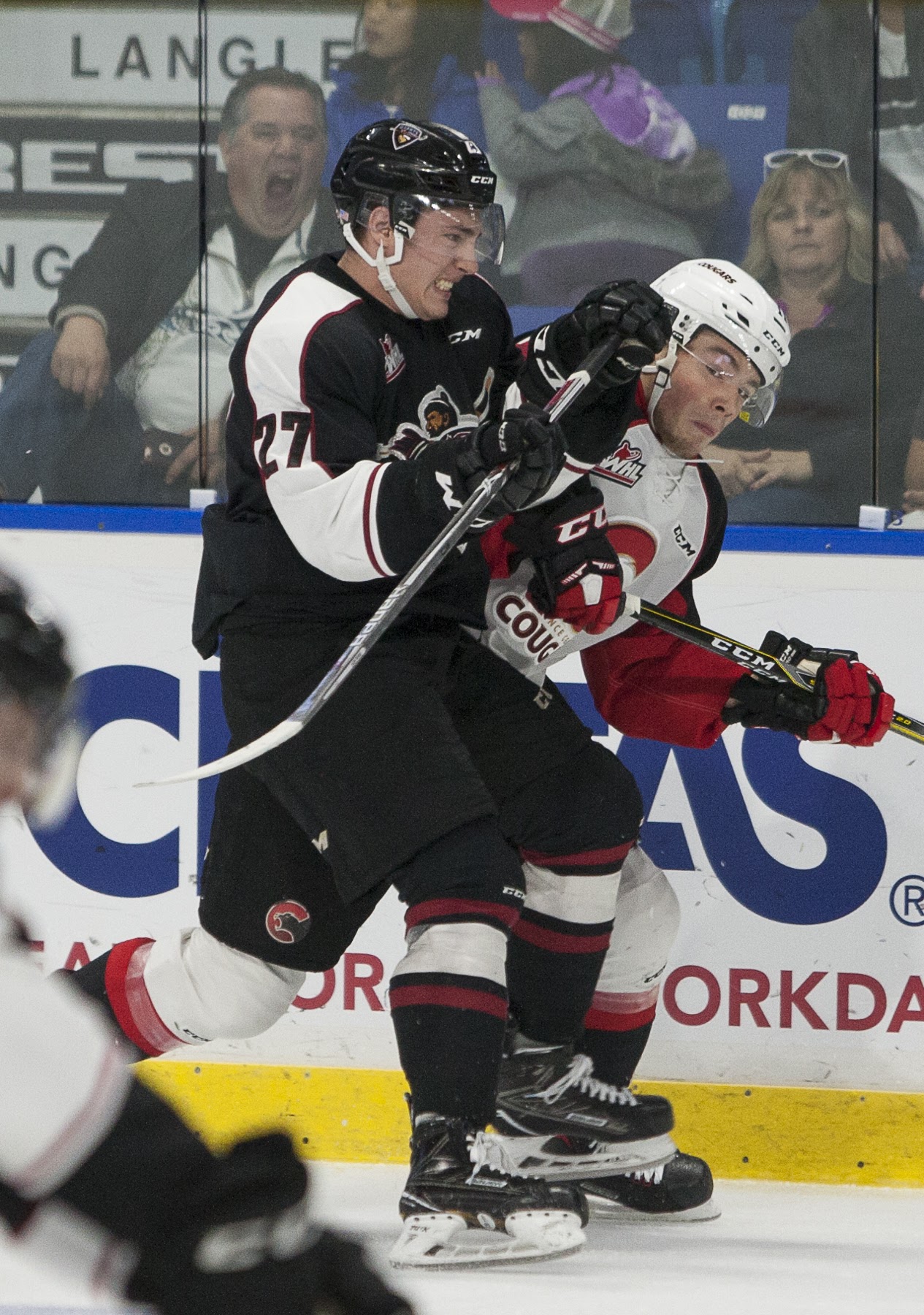 Vancouver Giants Brendan Semchuk finishes his check against the Prince George.