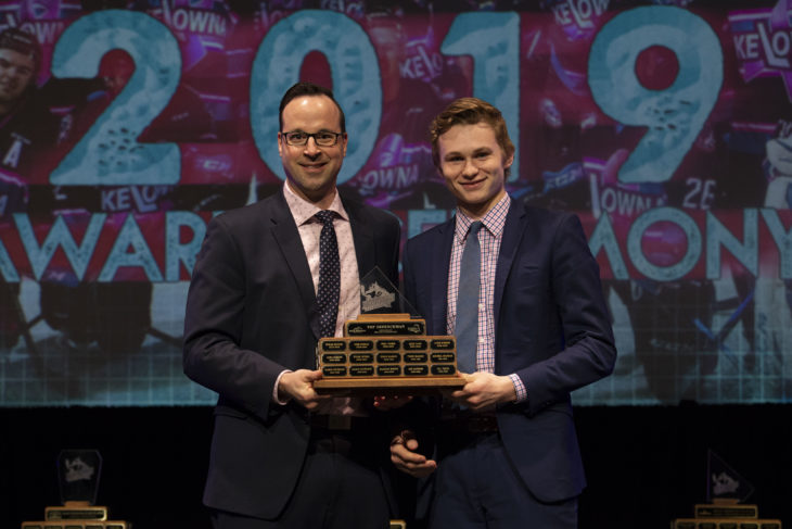 KELOWNA, BC - MARCH 17: Assistant coach Kris Mallette presents Kaedan Korczak #6 of the Kelowna Rockets with the Top Defenseman award at the annual Kelowna Rockets awards ceremony at Kelowna Community Theatre on March 17, 2019 in Kelowna, Canada. (Photo by Marissa Baecker/Shoot the Breeze)