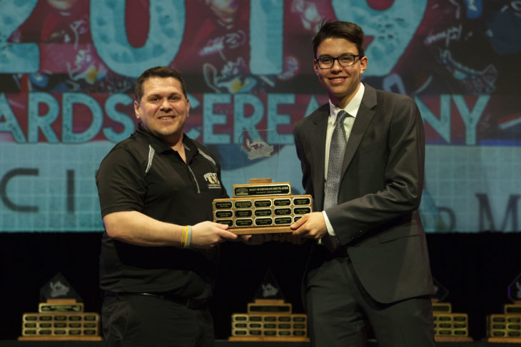 KELOWNA, BC - MARCH 17: Jeff MacIsaac of Popeye Supplements presents Devin Steffler #4 of the Kelowna Rockets with the Most Sportsmanlike award at the annual Kelowna Rockets awards ceremony at Kelowna Community Theatre on March 17, 2019 in Kelowna, Canada. (Photo by Marissa Baecker/Shoot the Breeze)