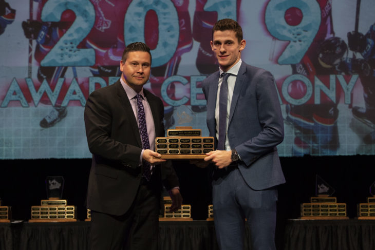 KELOWNA, BC - MARCH 17: Noel Anderson of MacDermott's Mens Wear presents the MVP award to Nolan Foote #29 of the Kelowna Rockets at the annual Kelowna Rockets awards ceremony at Kelowna Community Theatre on March 17, 2019 in Kelowna, Canada. (Photo by Marissa Baecker/Shoot the Breeze)
