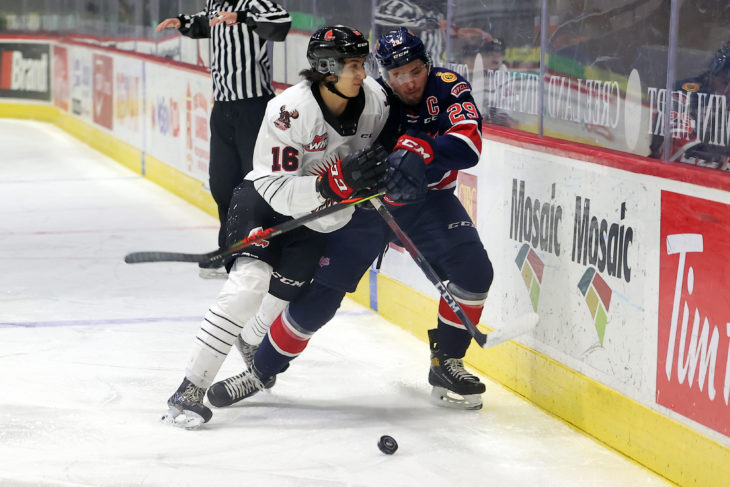 Moose Jaw Warriors defenceman Max Wanner delivers a hit against the Regina Pats in the Subway WHL Hub last season. (Keith Hershmiller Photography)