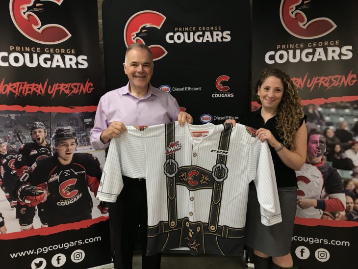 Cougars' Vice President, Andy Beesley & PGCF Director of Development, Mindy Stroet with the Oktoberfest jersey.