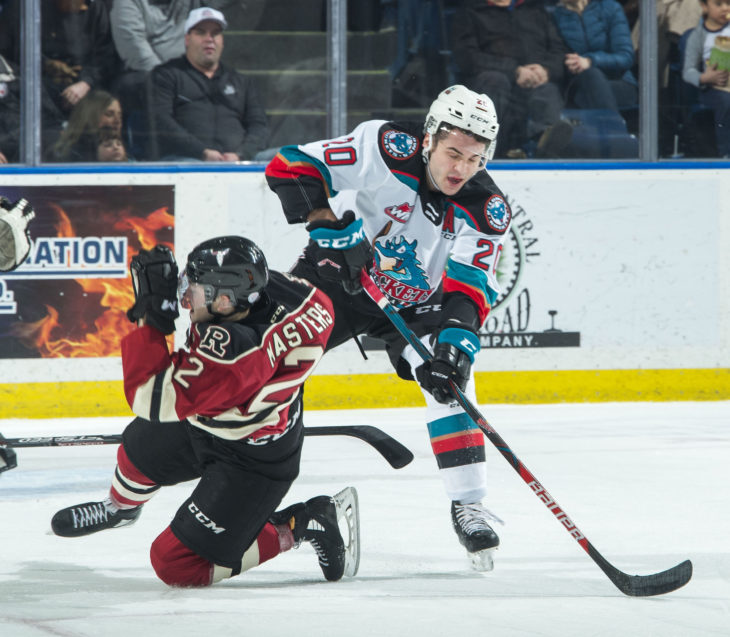 KELOWNA, BC - FEBRUARY 15: Kyle Masters #2 of the Red Deer Rebels collides with Matthew Wedman #20 of the Kelowna Rockets during first period at Prospera Place on February 15, 2020 in Kelowna, Canada. (Photo by Marissa Baecker/Shoot the Breeze)