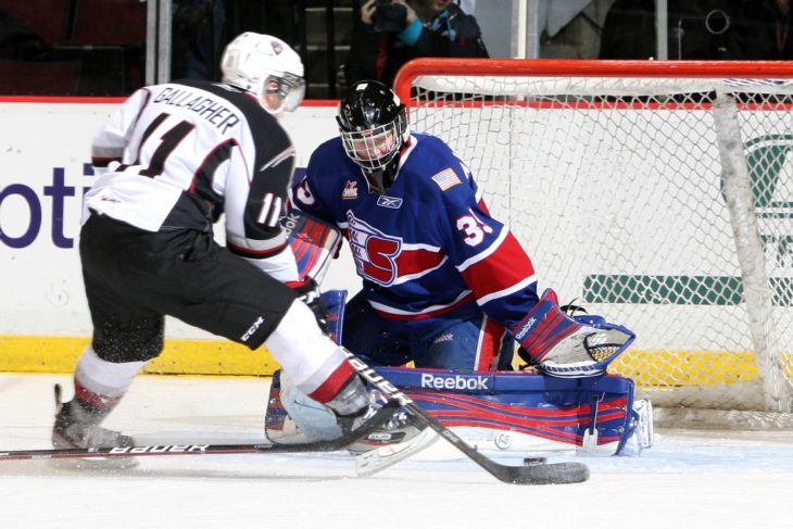 Brendan Gallagher shooting on Eric Williams in Game 2 of Spokane Chiefs vs. Vancouver Giants in the first round of WHL Playoffs.